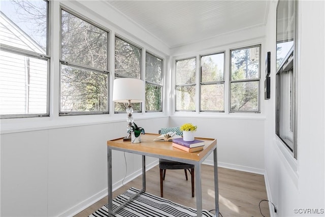 office with light wood-style flooring and baseboards