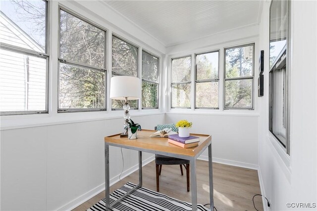 office with light wood-style flooring and baseboards