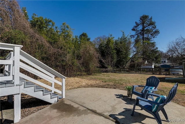 view of patio featuring fence