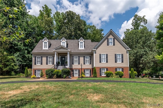 view of front of home with a front yard