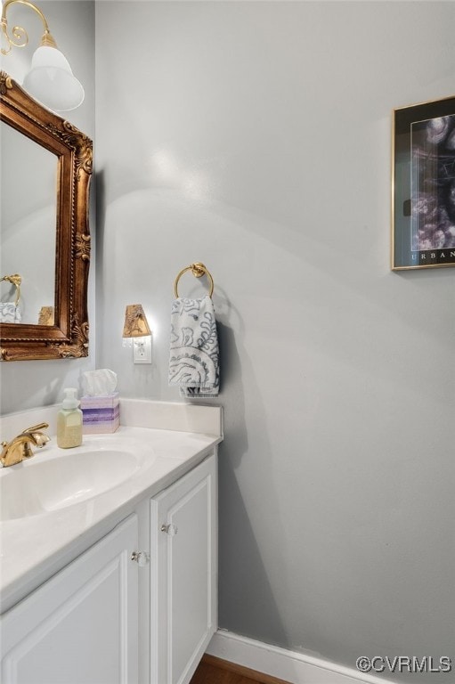 bathroom featuring vanity and baseboards