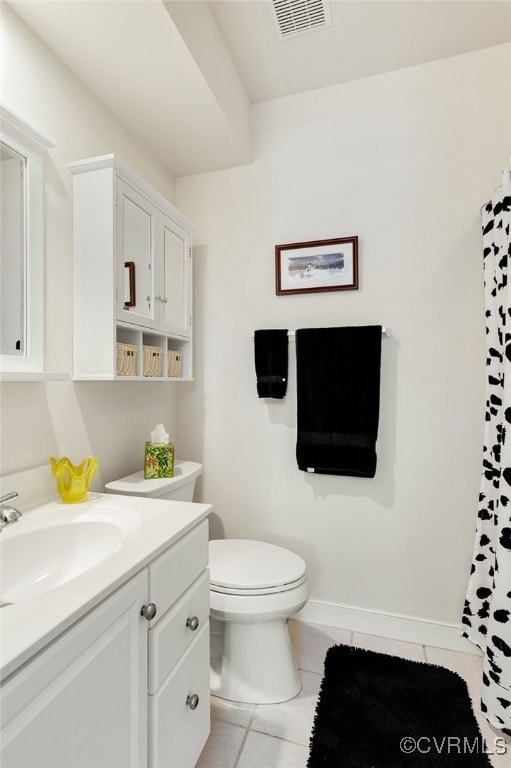 bathroom with visible vents, toilet, tile patterned flooring, baseboards, and vanity