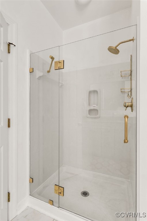 full bathroom with a shower stall