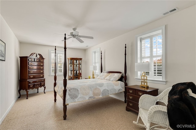 bedroom featuring visible vents, baseboards, carpet, and a ceiling fan