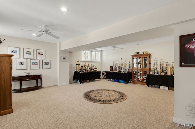 living area with recessed lighting, baseboards, carpet, and ceiling fan