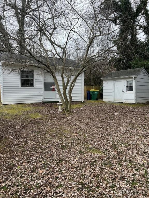 view of yard featuring a storage unit and an outbuilding