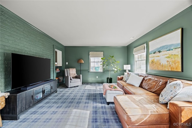 living room with crown molding and carpet