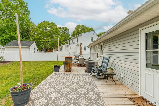 view of patio / terrace with central air condition unit, a wooden deck, and fence