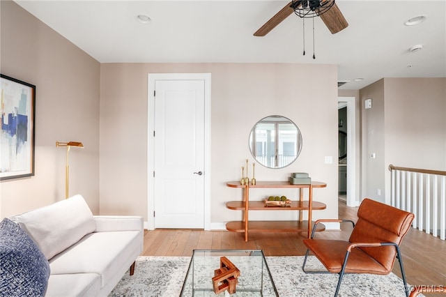 living room with recessed lighting, ceiling fan, baseboards, and hardwood / wood-style floors