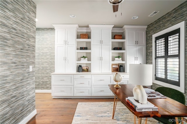 office with light wood-type flooring, visible vents, tile walls, and recessed lighting