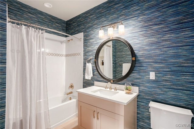 full bathroom with vanity, toilet, and shower / bath combo with shower curtain