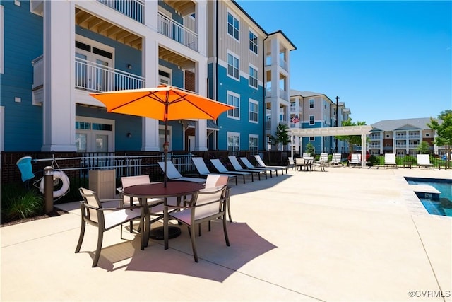 view of patio / terrace with a residential view and fence