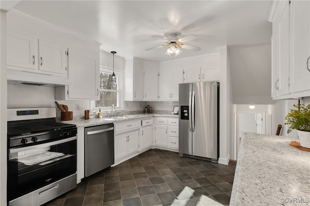 kitchen featuring a sink, white cabinetry, ventilation hood, appliances with stainless steel finishes, and ceiling fan