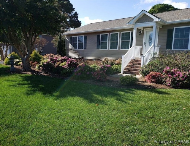560 Skipjack Dr, Heathsville, VA 22473 - view of front of home with a front lawn and roof with shingles