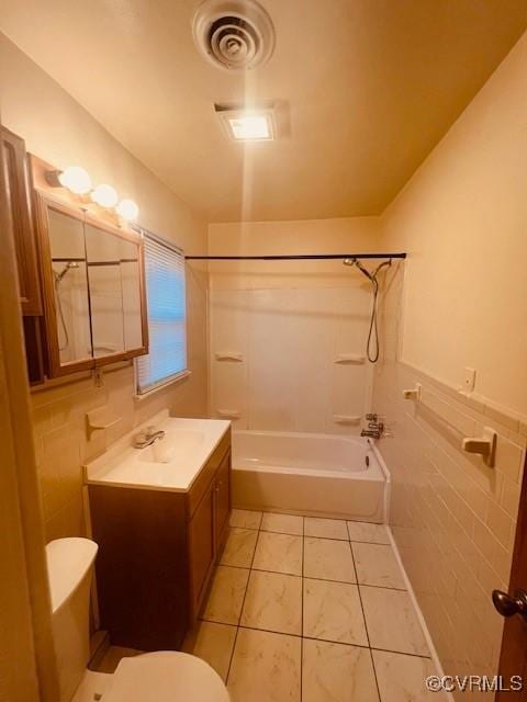 full bathroom with visible vents, toilet, tile walls, tile patterned flooring, and vanity