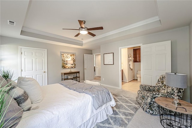 bedroom with visible vents, baseboards, ornamental molding, light carpet, and a raised ceiling