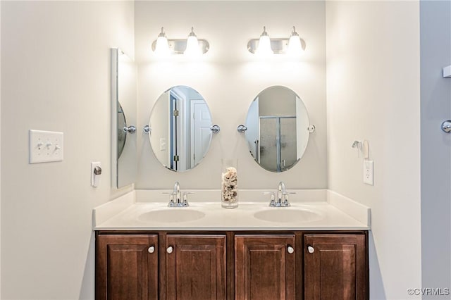 bathroom featuring double vanity and a sink