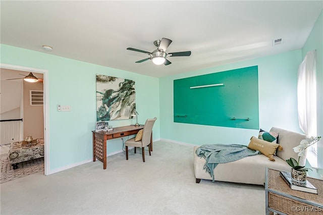 interior space with visible vents, baseboards, and ceiling fan