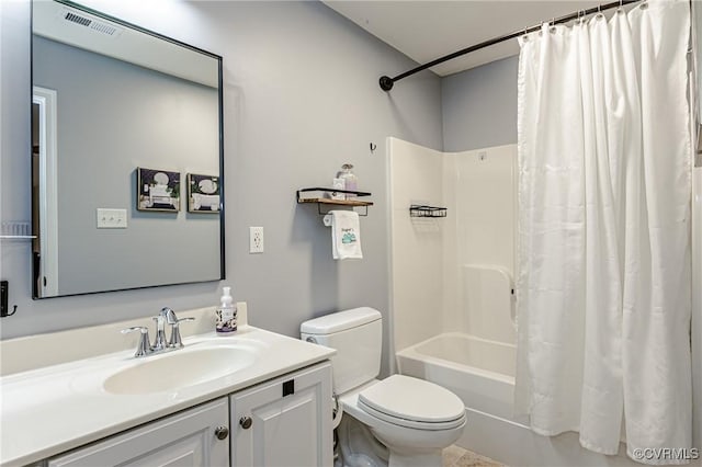 bathroom with vanity, toilet, visible vents, and shower / bath combo with shower curtain