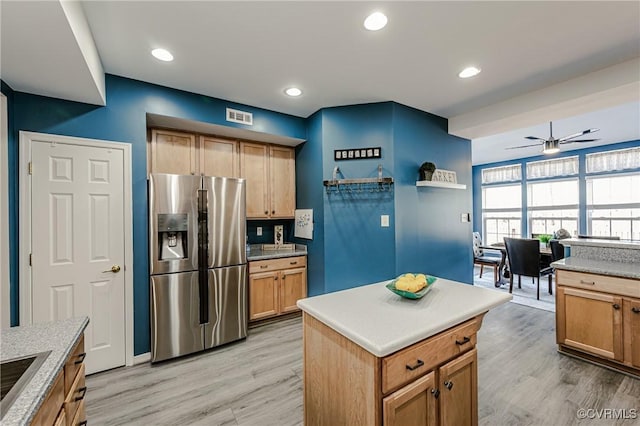 kitchen featuring recessed lighting, stainless steel fridge with ice dispenser, visible vents, and light wood-type flooring