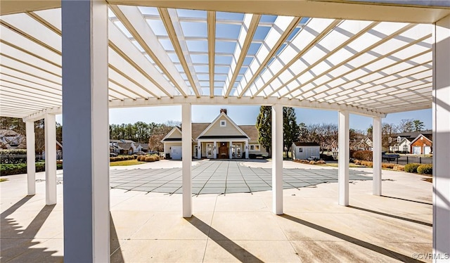 view of patio / terrace featuring a residential view and a pergola