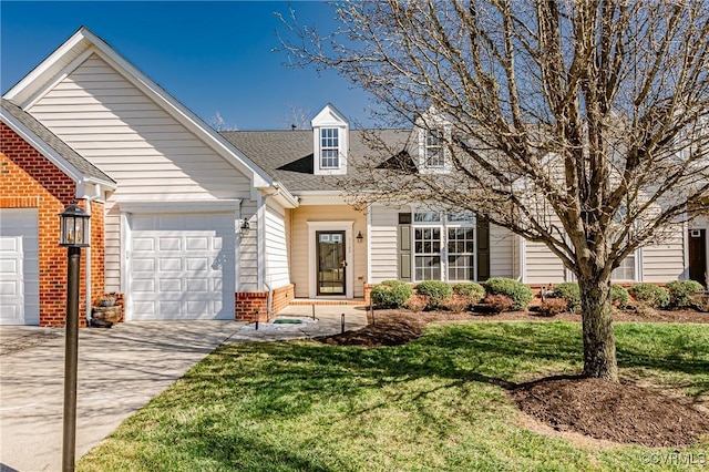 view of front facade featuring a front lawn, a garage, brick siding, and driveway