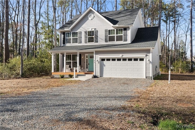 traditional-style house featuring a porch, driveway, and a shingled roof