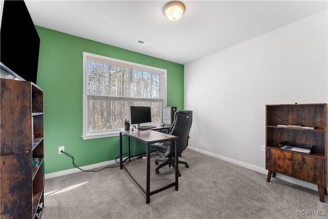 office space featuring carpet flooring, baseboards, and visible vents