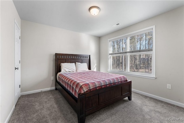 bedroom with visible vents, baseboards, and carpet floors