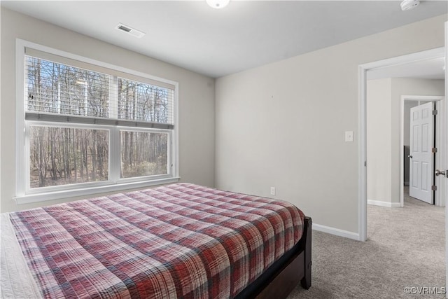 bedroom featuring visible vents, baseboards, and carpet floors