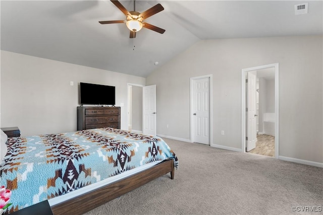 bedroom with baseboards, visible vents, carpet floors, ensuite bath, and vaulted ceiling