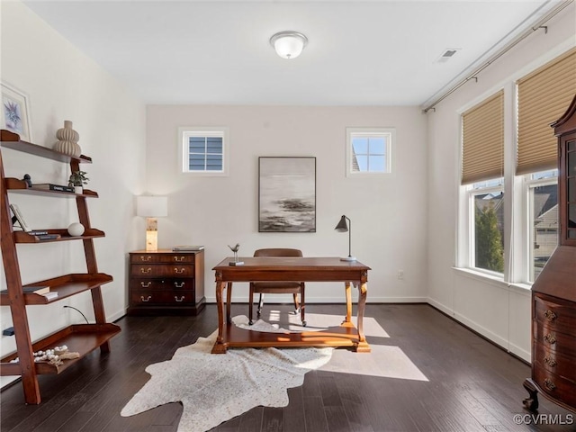 office area featuring a wealth of natural light, baseboards, and wood-type flooring