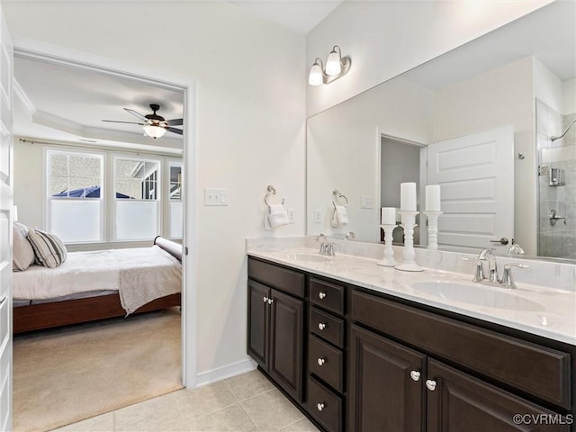 full bath with tile patterned flooring, ensuite bath, a tile shower, and a sink