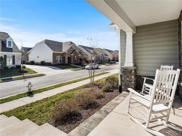 exterior space with a residential view and covered porch