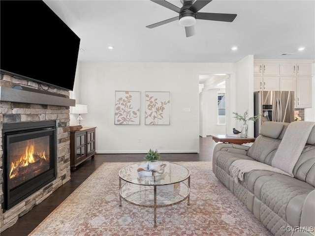 living room with dark wood-style floors, baseboards, recessed lighting, a fireplace, and ceiling fan