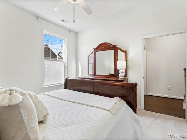 bedroom with visible vents, baseboards, and a ceiling fan