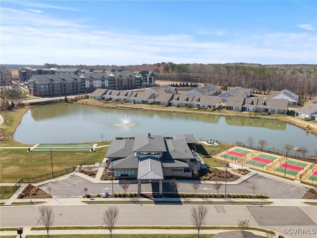 birds eye view of property featuring a residential view and a water view