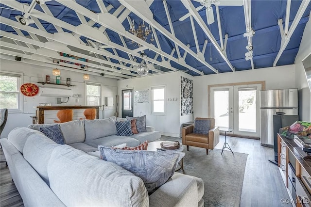 living room with wood finished floors and french doors