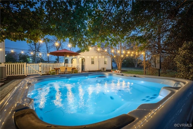 view of pool with a gate and fence