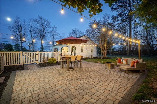 view of patio / terrace featuring outdoor lounge area, a fenced backyard, and a gate