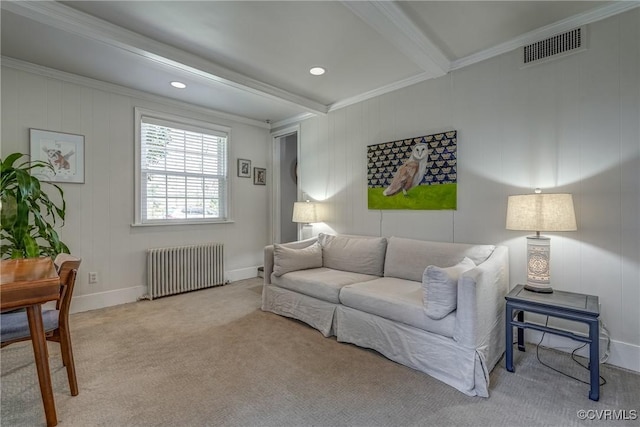 living room featuring visible vents, baseboards, carpet, beamed ceiling, and radiator heating unit