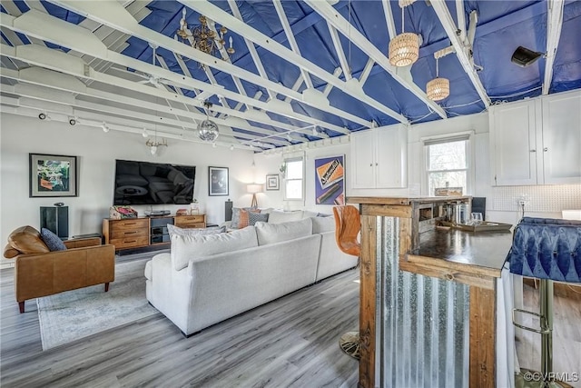 living room with a healthy amount of sunlight and wood finished floors