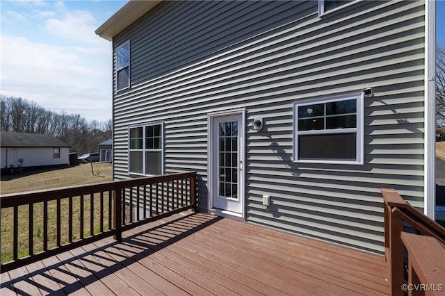 wooden deck with a yard