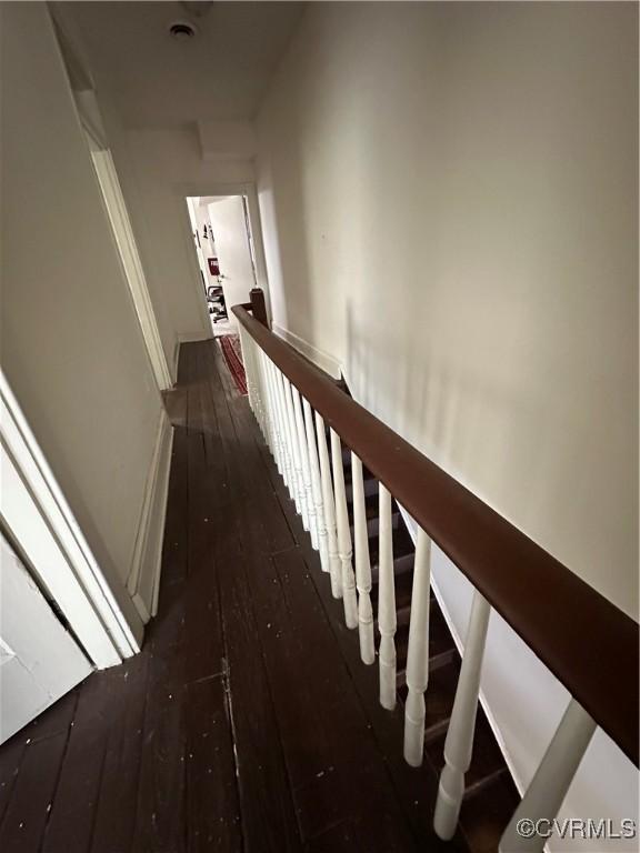 stairway with hardwood / wood-style flooring