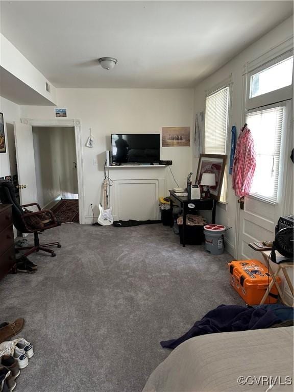 carpeted living room featuring visible vents