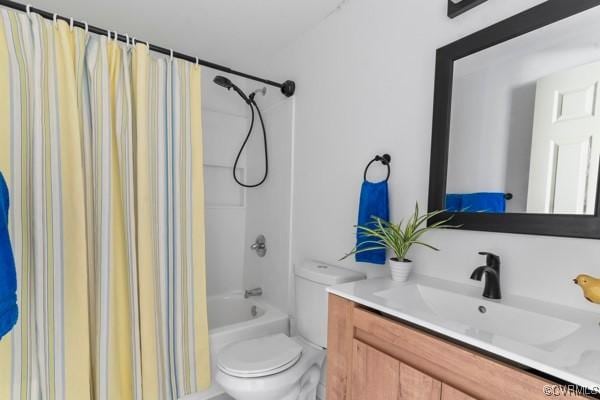 full bath with vanity, toilet, and shower / bath combo