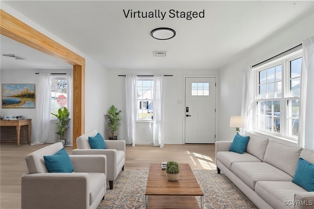 401 Hunt Ave, Richmond, VA 23222 - living room featuring visible vents, light wood-style flooring, and plenty of natural light