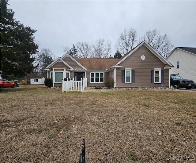 ranch-style home with a front yard