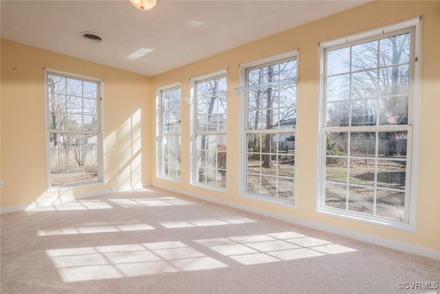 unfurnished sunroom with visible vents and plenty of natural light