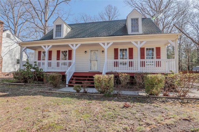 view of front of house with covered porch and roof with shingles